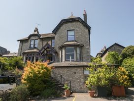 A house with a garden and steps at Lilac Cottage in Grange-Over-Sands