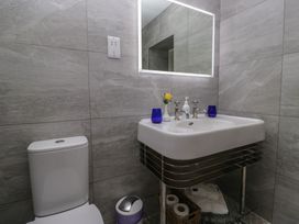 A bathroom with a sink and toilet at Lilac Cottage in Grange-Over-Sands
