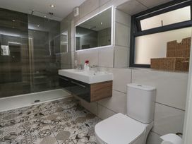 A bathroom with a shower and sink at Lilac Cottage in Grange-Over-Sands