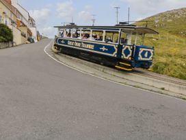 A tram on a hill road at Fox House in Llandudno