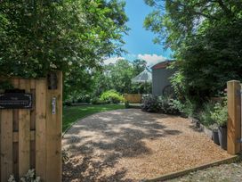 A garden with gravel path and plants at The Highwood Hut near Liskeard