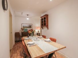 A dining room with a table set for meals at 2 Aqueduct Cottages Chirk Bank near Chirk