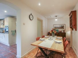 A dining room with a table and chairs at 2 Aqueduct Cottages Chirk Bank near Chirk