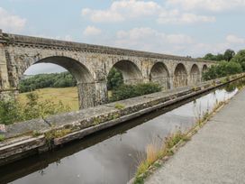 A viaduct with arches over a canal at 2 Aqueduct Cottages in Chirk Bank near Chirk