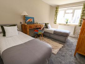 A bedroom with two beds and a dresser at Lily's Pad in Weston, Portland