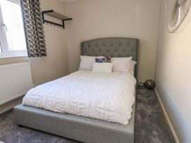 A bedroom with a bed and window at Lily's Pad Weston, Portland