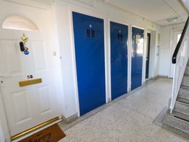 A hallway with a door and lockers at Lily's Pad Weston, Portland