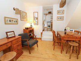 A dining room with a table and chairs at No.23 Queen St, Aberystwyth