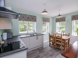 A kitchen with a countertop and dining table at Whinstone Cottage Esk Valley near Grosmont