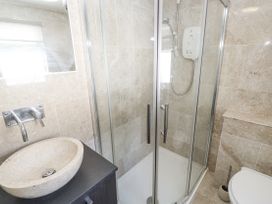 A bathroom with a shower and a sink at Treliance in Truro