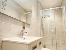 A bathroom with a sink and shower at Treliance in Truro