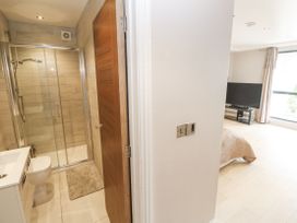 A bathroom with shower, toilet, and sink at Treliance in Truro