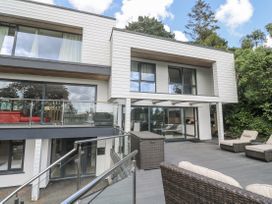 An outdoor area with a house and balcony at Treliance in Truro