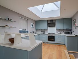 A kitchen with skylight and modern appliances at The Well House in Lyme Regis