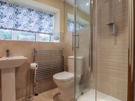 A bathroom with a sink, toilet, and shower at The Well House in Lyme Regis