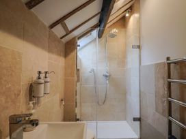 A bathroom with a shower and washbasin at The Well House in Lyme Regis