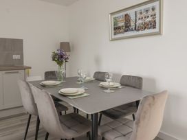 A dining area with a table set for meals at Castle View in Scarborough