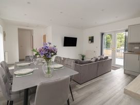 A living room with a dining area and sofa at Castle View in Scarborough