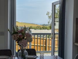 A dining room with flowers on the table at Castle View in Scarborough