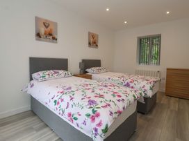 A bedroom with two single beds and a dresser at Woodside in Scarborough