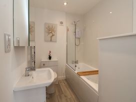 A bathroom with a bathtub and basin at Woodside in Scarborough