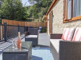 An outdoor seating area with a coffee table and sofa at Woodside in Scarborough