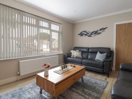 A living room with a sofa and coffee table at 7 Cedar Drive Preston