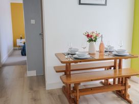 A dining table with plates and glasses at 7 Cedar Drive Preston
