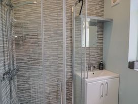 A bathroom with a shower and sink at 7 Cedar Drive Preston