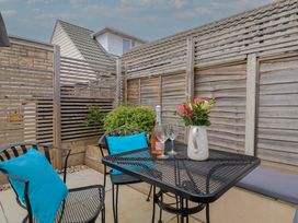 An outdoor seating area with a table and chairs at 7 Cedar Drive Preston