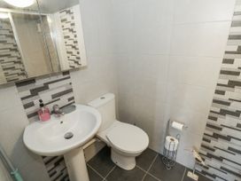 A bathroom with a sink and toilet at The Lodge 