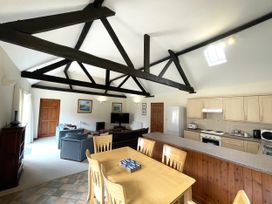 A living room and kitchen with furniture and appliances at Beechwood in Wood Norton near Foulsham
