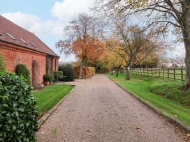 A gravel path and trees at Beechwood in Wood Norton