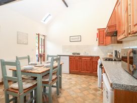 A kitchen with a table and chairs at Willow in Wood Norton near Foulsham