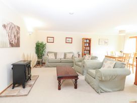 A living room with sofas and a coffee table at Sycamore in Wood Norton near Foulsham