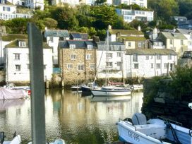 Boats at a dock with buildings in the background at Harbour View in Polperro