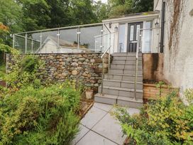 A set of stone steps leading to a house entrance at High Cross in Keswick