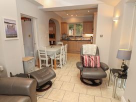 A kitchen with a dining table and chairs at High Cross in Keswick