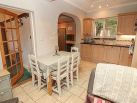 A kitchen with a dining table and chairs at High Cross in Keswick