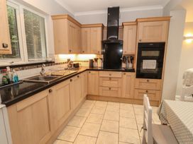 A kitchen with cabinets and appliances at High Cross in Keswick