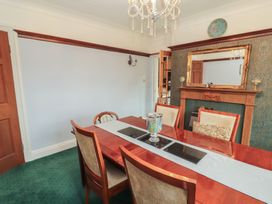 A dining room with a table and chairs at High Cross in Keswick