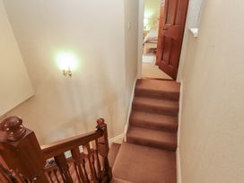 A staircase leading to a door at High Cross in Keswick
