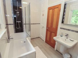 A bathroom with a bathtub and shower at High Cross in Keswick