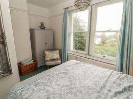 A bedroom with a bed and a window at High Cross in Keswick