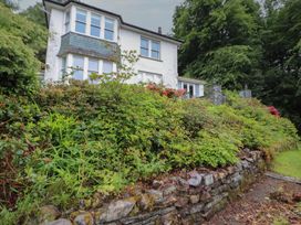 A house with garden and stone wall at High Cross in Keswick