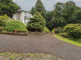 A house with a driveway and greenery at High Cross in Keswick