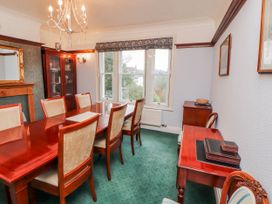 A dining room with a table and chairs at High Cross in Keswick