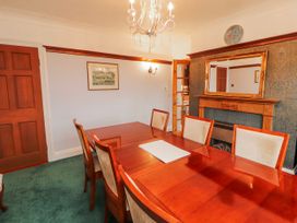 A dining room with a table and chairs at High Cross in Keswick
