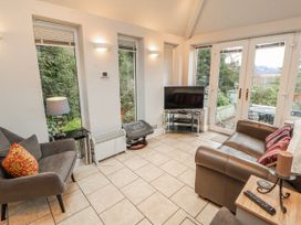 A living room with a sofa and television at High Cross in Keswick