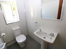 A bathroom with a sink and toilet at Dolcoed in Manordeilo near Llangadog